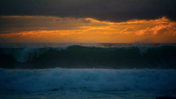 istock Powerful storm wave rolling stunning cloudy seascape. Huge ocean surf crashing 1942643804