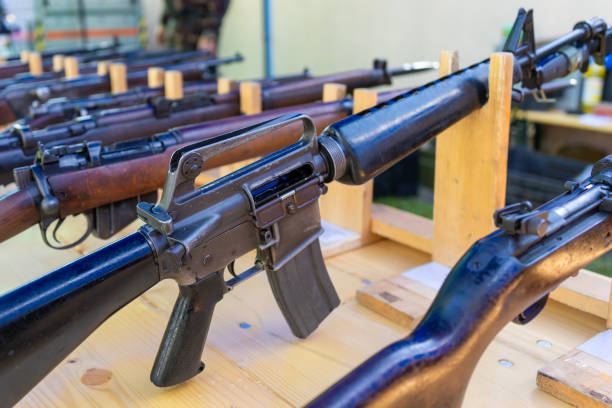 istock Old American classic M16 assault rifle among other weapons 1942643806