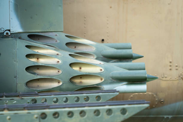 istock Old Soviet-made camouflage Mi-24 military helicopter rocket pods 1942643814