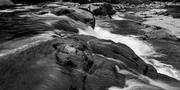 Swift River near the Kancamagus Highway towards White Mountain.  This is a long exposure of the Swift River running over boulders.