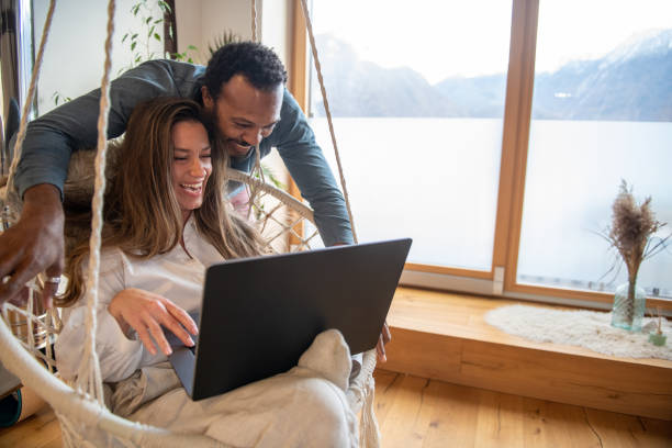 istock Man and woman working together from home 1942659970