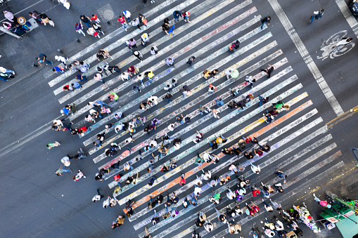A Bustling City Intersection Captured From Above With Pedestrians Crossing in Multiple Directions