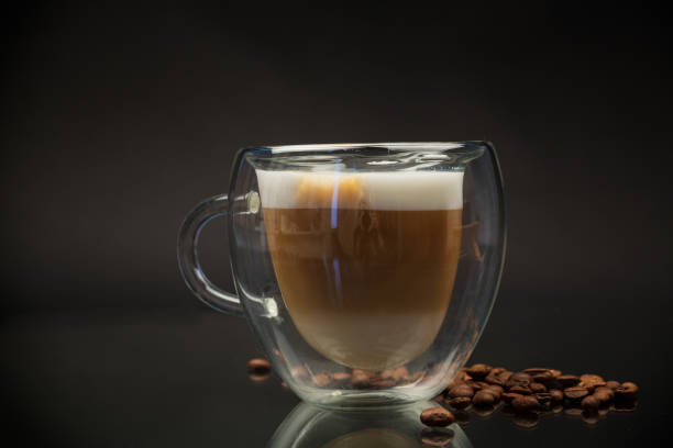 istock hot coffee with milk on black background 1942683138