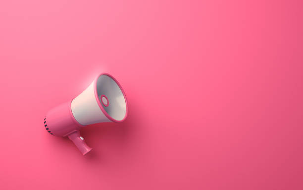 istock Pink & White Megaphone on Soft Yellow Background 1942693804