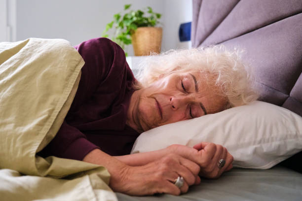 istock Old Latin woman sleeping on her bed. Oversleep, asleep. 1942699026