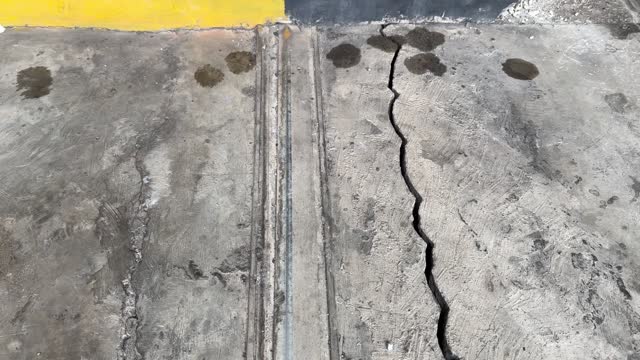 Close angle of asphalt road or street cracked