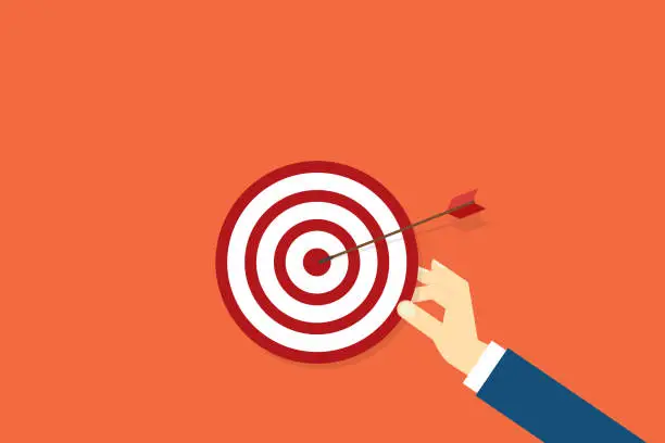Vector illustration of Hand holding a target, showing a goal. Red arrow hits the center. Business challenge failure and success concept.
