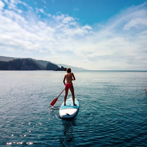 Woman paddling on a stand-up paddleboard