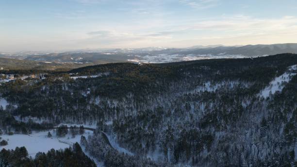 istock Flying over snowy highland mountains Tara 1942737308