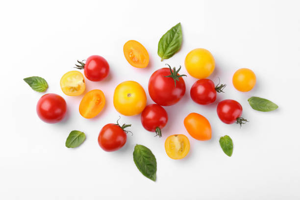 istock Flat lay composition with different whole and cut tomatoes on white background 1942787184
