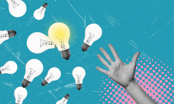 istock Art collage of a hand reaching for a light bulb. 1942789843
