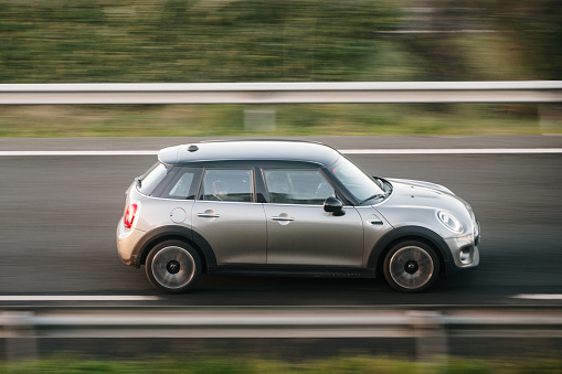 Santander, Spain - 12 January 2024: A MINI Cooper in motion on a highway