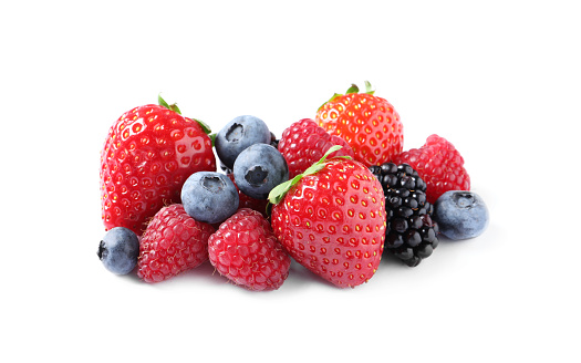 Many different ripe berries isolated on white