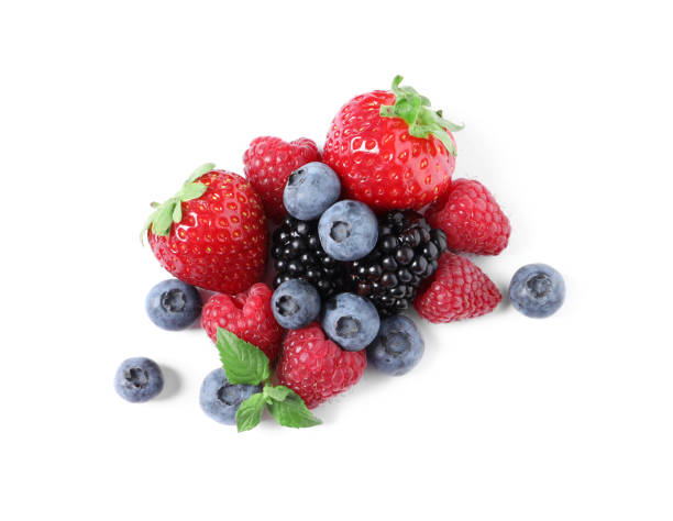 istock Many different ripe berries and mint leaves isolated on white, top view 1942803065