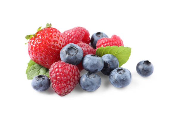 istock Many different ripe berries and mint leaves isolated on white 1942806267