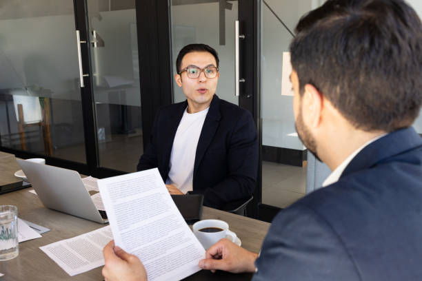 istock Businessman sharing a proposal with a client in a meeting room 1942806795