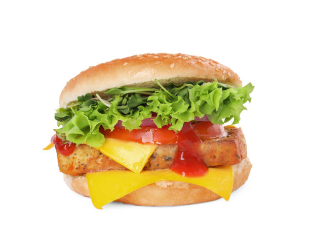 istock Delicious burger with tofu, vegetables and sauce isolated on white 1942829127