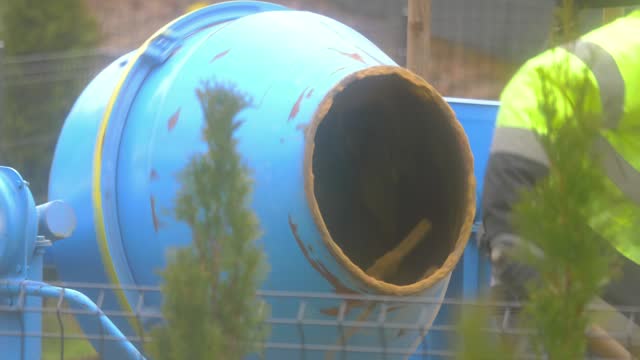 Concrete mixer at a construction site mixing material in 4k slow motion 60fps