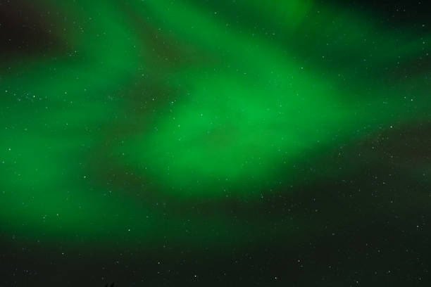 Green and red northern lights in the sky