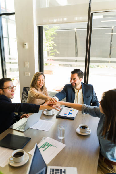 istock Business team putting hands together with plenty of copy space 1942864043