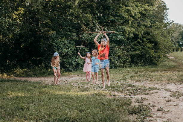 istock A lively scene unfolds as elementary school kids engage in outdoor play during summer camp. 1942876169