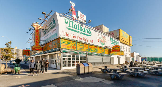 nathan's fast food stand restaurant in coney island, ney york, usa - nathans coney island new york city brooklyn стоковые фото и изображения