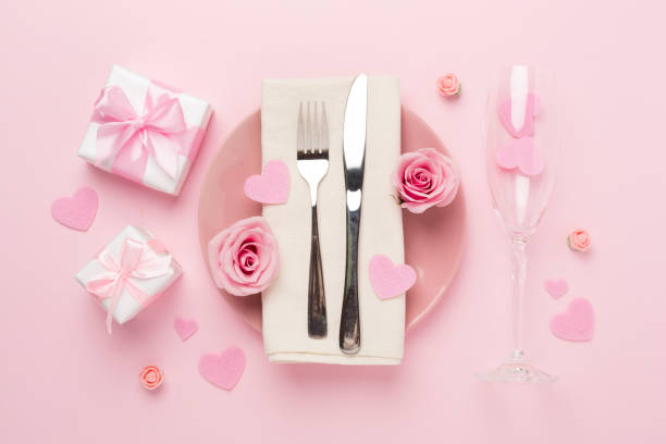 istock Festive table setting for Valentine's Day on color background, top view 1942926005