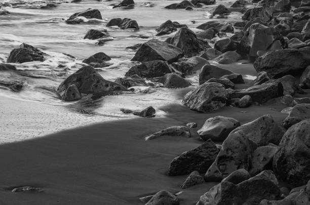 istock beach with black volcanic sand on  Tenerife 1942933485