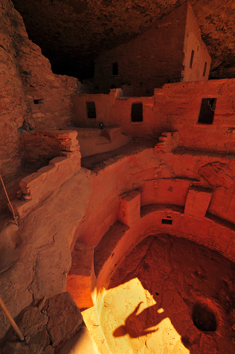 Shadow of a tourist on a kiva at the Cliff Palace ruins, the largest Ancestral Puebloans cliff dwelling in North America, Mesa Verde National Park, Colorado, USA.