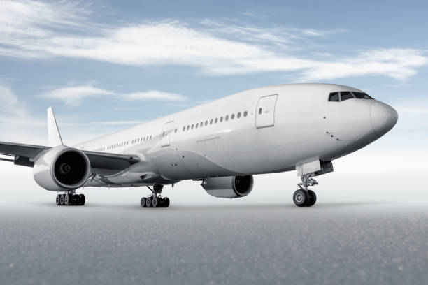 istock Wide body passenger aircraft isolated on bright background with sky 1942940645