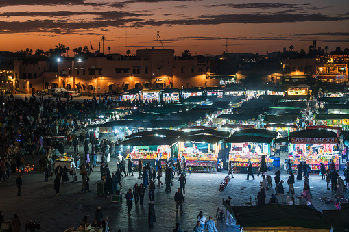 Marrakesh Morocco - January 04, 2024: Jamaa el Fna market square at dusk, Marrakesh, Morocco, north Africa. Jemaa el-Fnaa, Djema el-Fna or Djemaa el-Fnaa is a famous square and market place in Marrakesh's medina quarter.