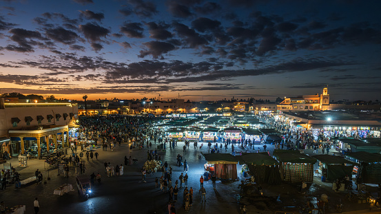 Marrakesh Morocco - January 04, 2024: Jamaa el Fna market square at dusk, Marrakesh, Morocco, north Africa. Jemaa el-Fnaa, Djema el-Fna or Djemaa el-Fnaa is a famous square and market place in Marrakesh's medina quarter.