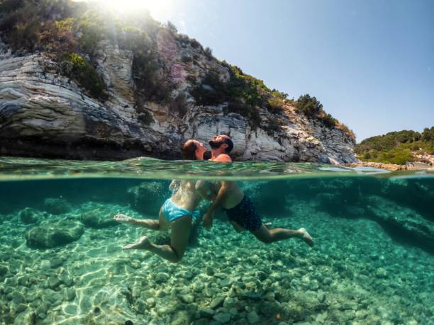 istock Couple having fun in the sea 1942960192