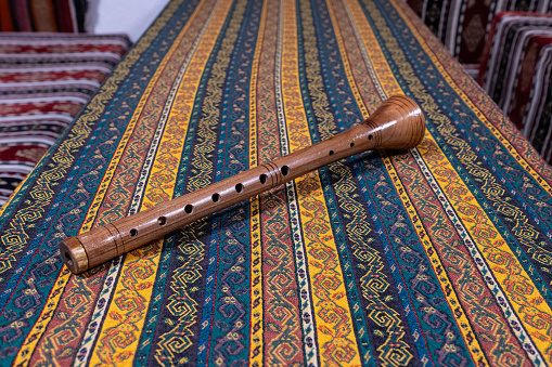 Turkish musical instrument Zurna on a locally woven tablecloth.