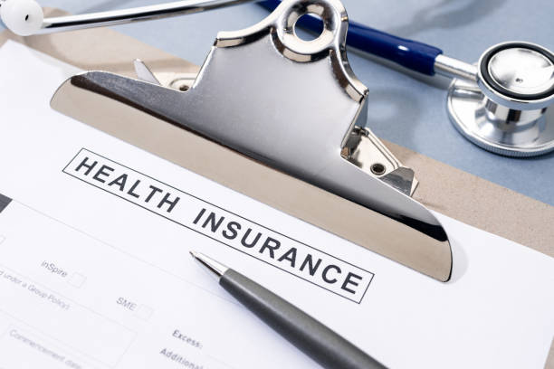 istock Health Insurance form and stethoscope on desk 1943009076