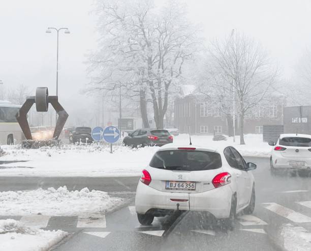 Navigating a slippery road  in Aalborg with poor visibility due to fog. The photo was taken at Thistedvej in Aalborg, Denmark on January 11th 2024.
