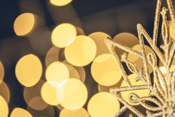 Christmas background with decorative snowflake and bokeh lights. Greeting card design. Copy space.