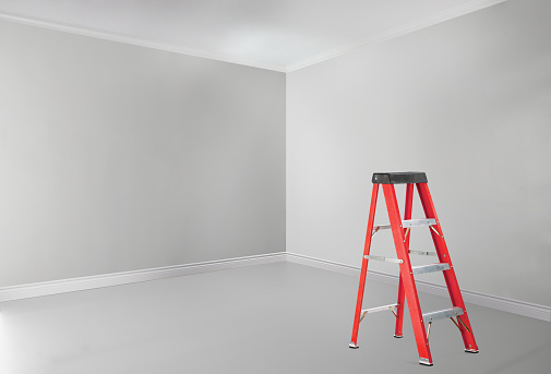 Metal ladder in old empty building, low angle view