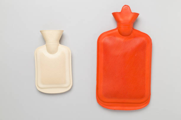 istock Rubber water warmer bag on color background 1943056886