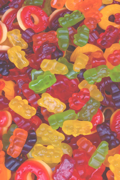 istock Assorted colorful gummy candies. Jelly donuts. Jelly bears. 1943071171
