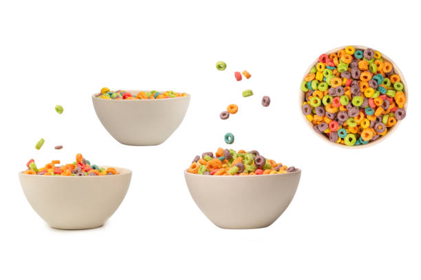 istock Colorful cereal box for morning breakfast. Corn flakes falling to the white bowl. Motion. 1943071173