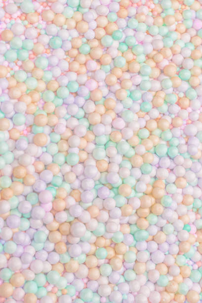 istock Purple, yellow, blue plastic balls. 1943071703