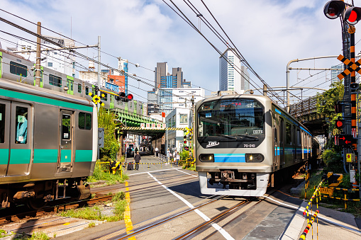 Tokyo, Japan - September 26, 2023: Commuter trains of Japan Rail JR East at Saikyo Line near Yoyogi in Tokyo, Japan.