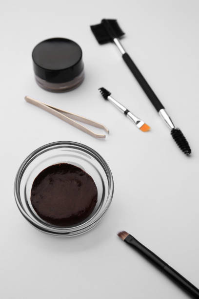 istock Eyebrow henna and professional tools on white background, closeup 1943148894