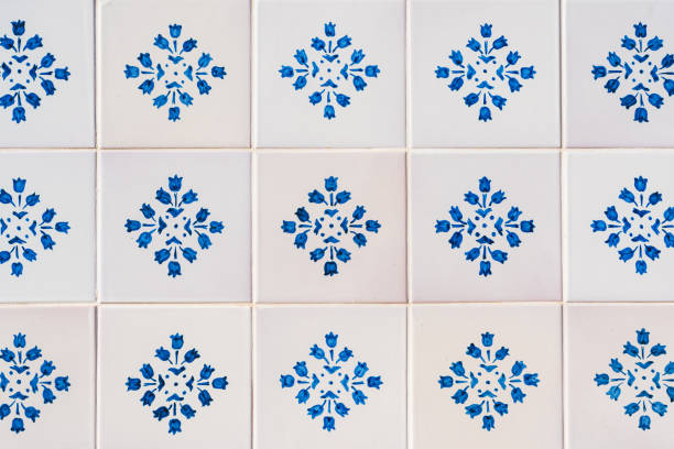 Ceramic square  tiles with small ornamental mosaic pieces. Old tiles abstract pattern, background