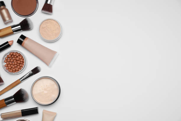 istock Face powders and other makeup products on white background, flat lay. Space for text 1943150987