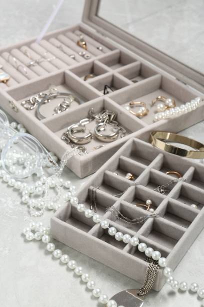 istock Jewelry boxes with many different accessories on light grey table, closeup 1943163014
