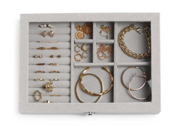 istock Jewelry box with many different golden accessories isolated on white, top view 1943164061