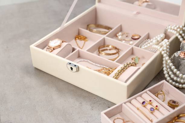 istock Jewelry boxes with many different accessories on light grey table, closeup 1943164066