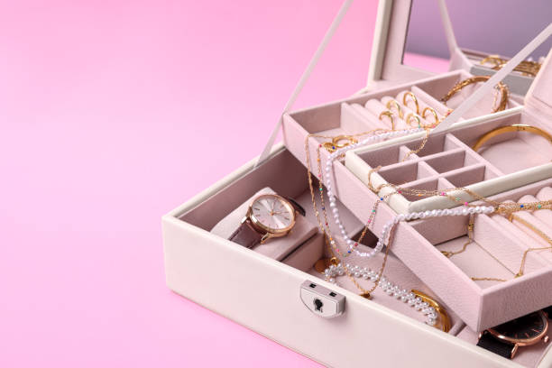 istock Jewelry box with many different accessories on pink background, closeup. Space for text 1943165143
